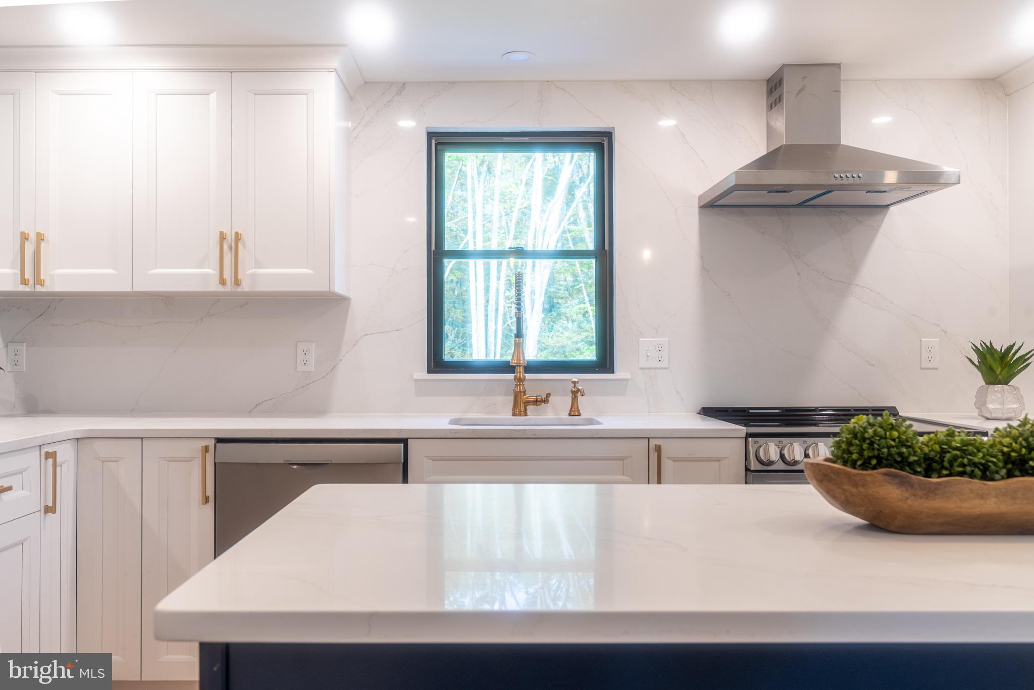 933 Forrest Road Sellersville, PA 18960 - Photo 9 of 56 a kitchen with a sink a counter top space and a window
