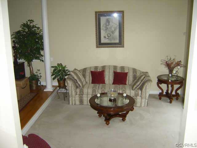 11630 Stephens Point Drive Chester, VA 23831 - Photo 2 of 10 a view of a dining room with furniture and a potted plant