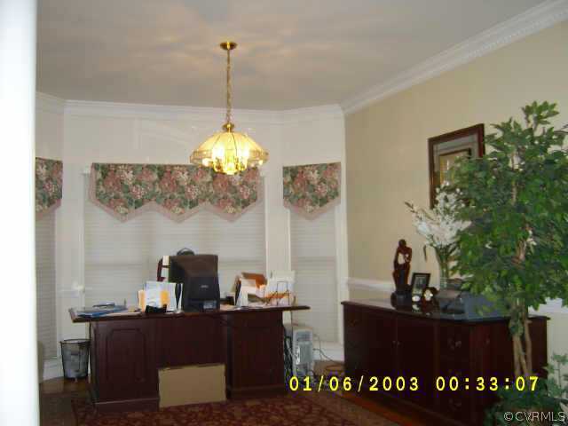 11630 Stephens Point Drive Chester, VA 23831 - Photo 3 of 10 a view of a workspace with furniture and a potted plant