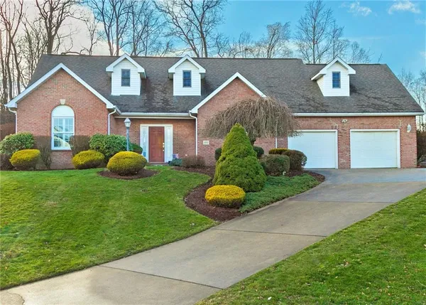 a front view of house with garden