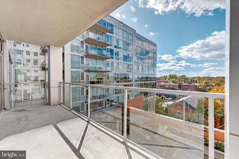 a view of balcony with furniture