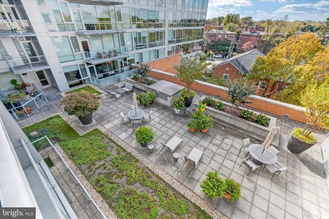 an aerial view of a house with a yard and lake view