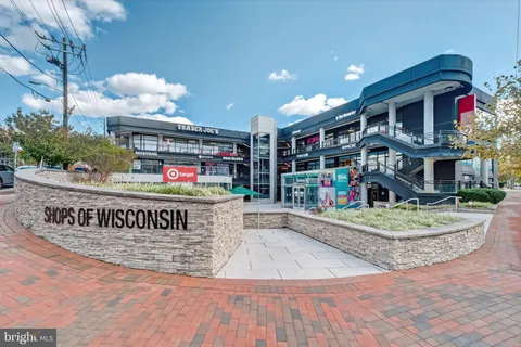a view of street with shops