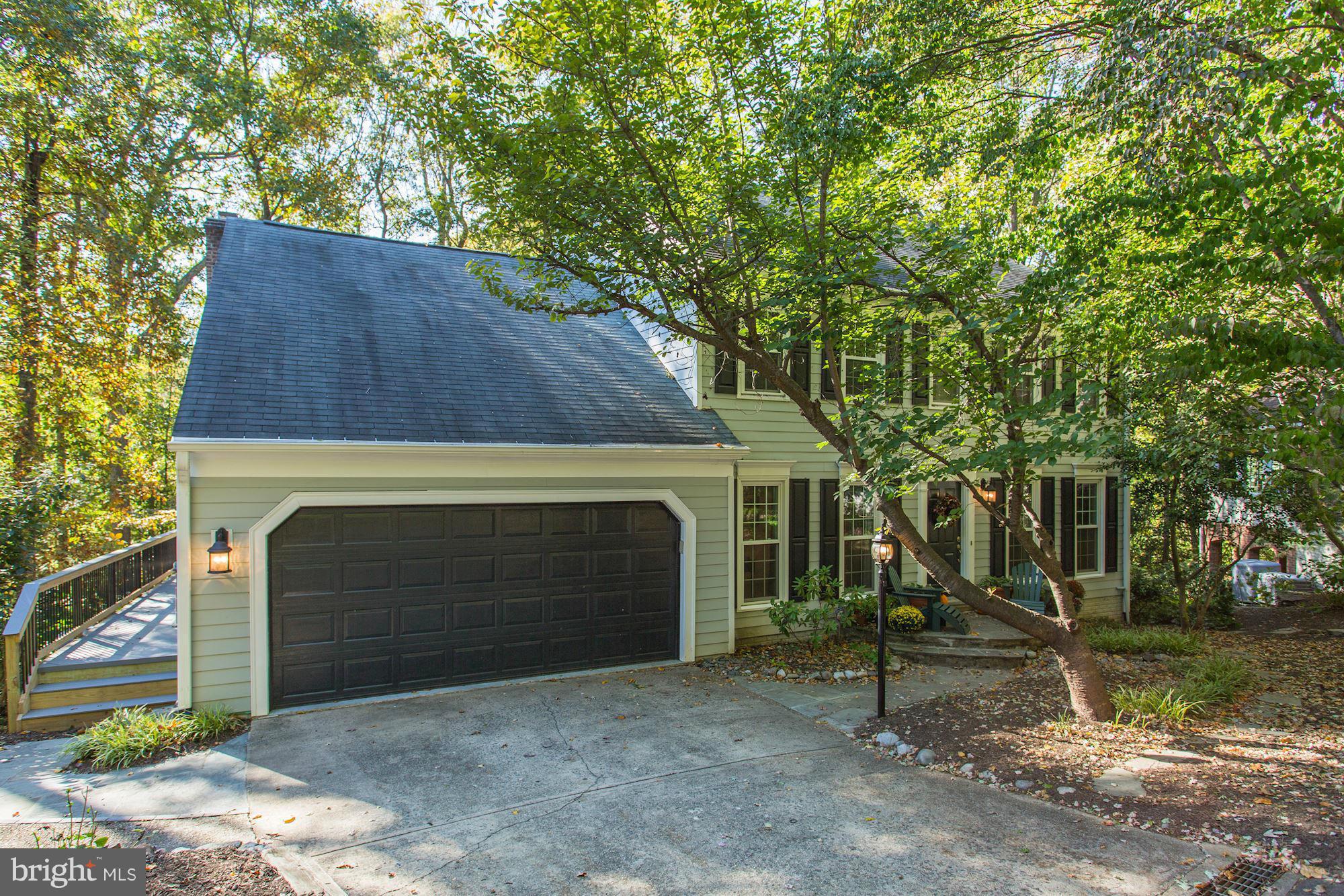2232 Wakerobin Lane Reston, VA 20191 - Photo 1 of 30 a front view of a house with a yard