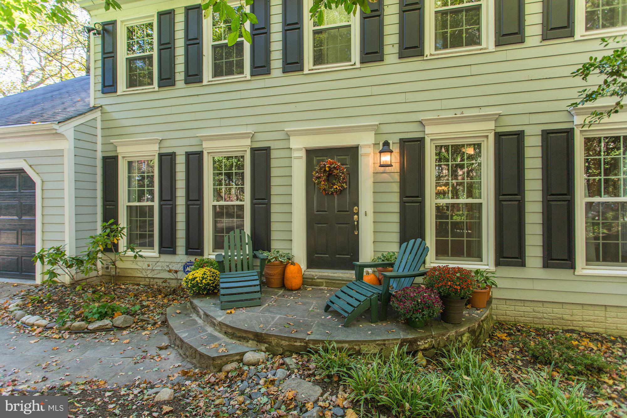 2232 Wakerobin Lane Reston, VA 20191 - Photo 2 of 30 a front view of a house with a chairs and porch