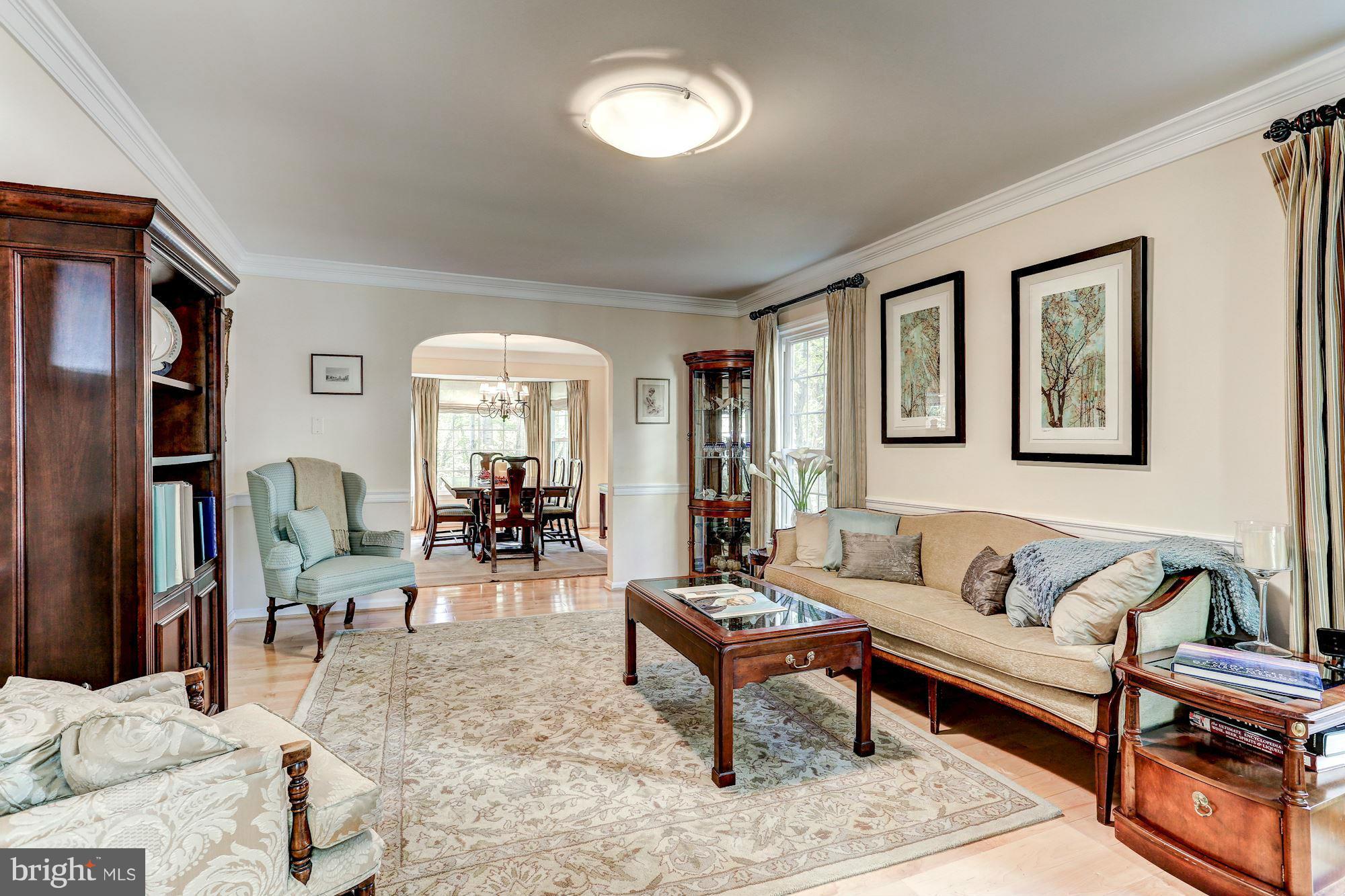 2232 Wakerobin Lane Reston, VA 20191 - Photo 11 of 30 a living room with furniture and a wooden floor