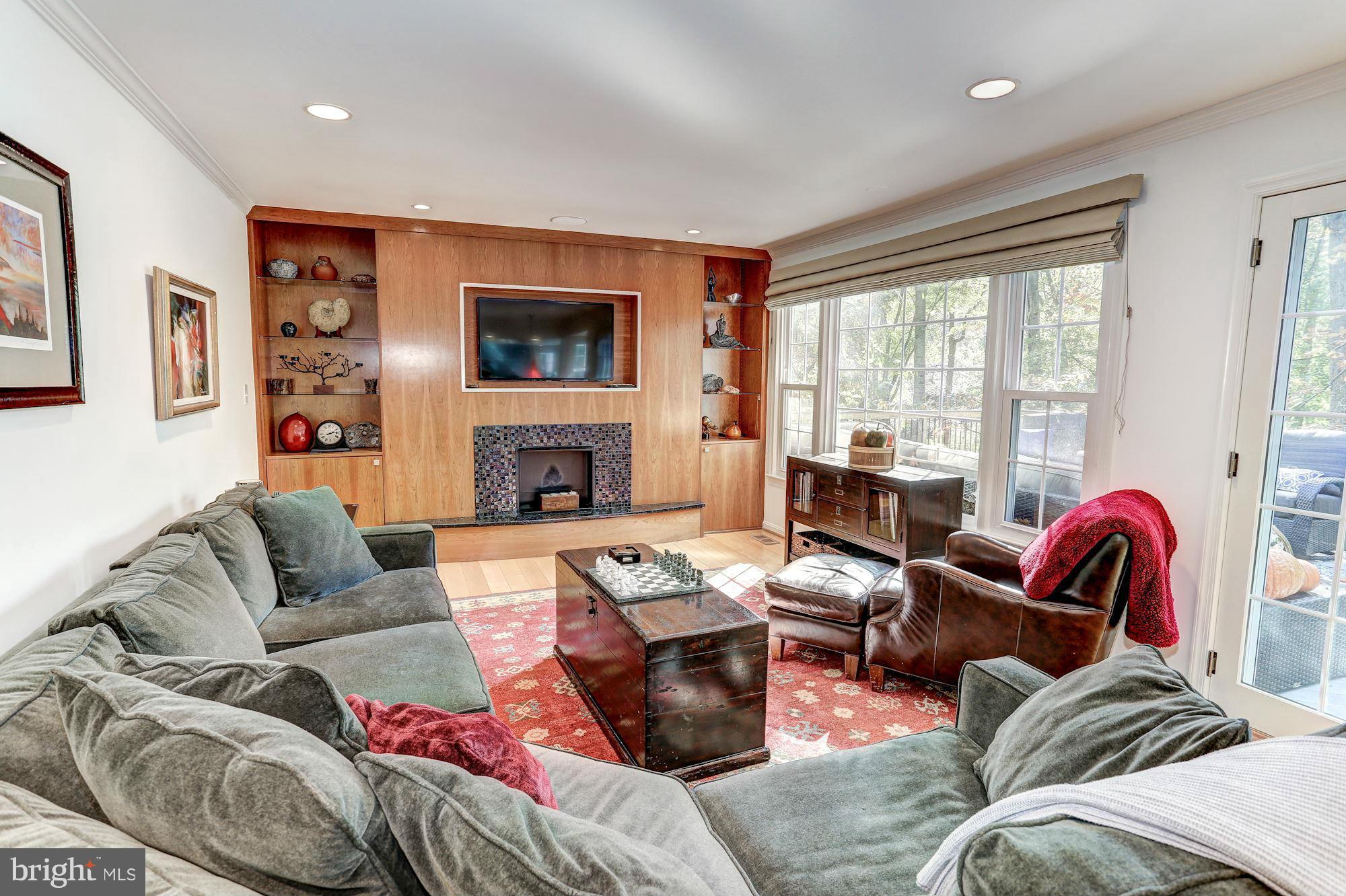 2232 Wakerobin Lane Reston, VA 20191 - Photo 13 of 30 a living room with furniture fireplace and flat screen tv