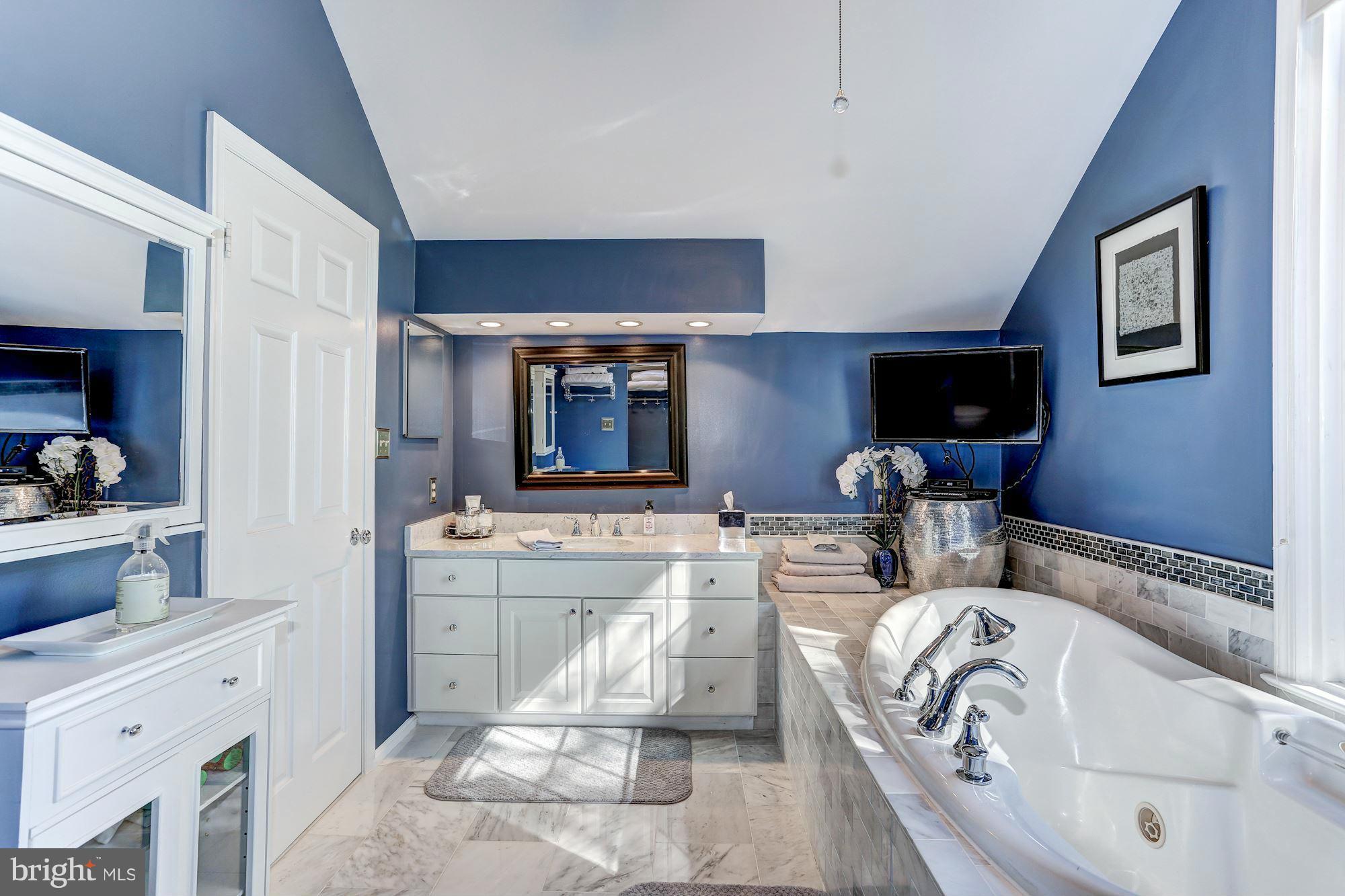 2232 Wakerobin Lane Reston, VA 20191 - Photo 16 of 30 a living room with furniture and a flat screen tv