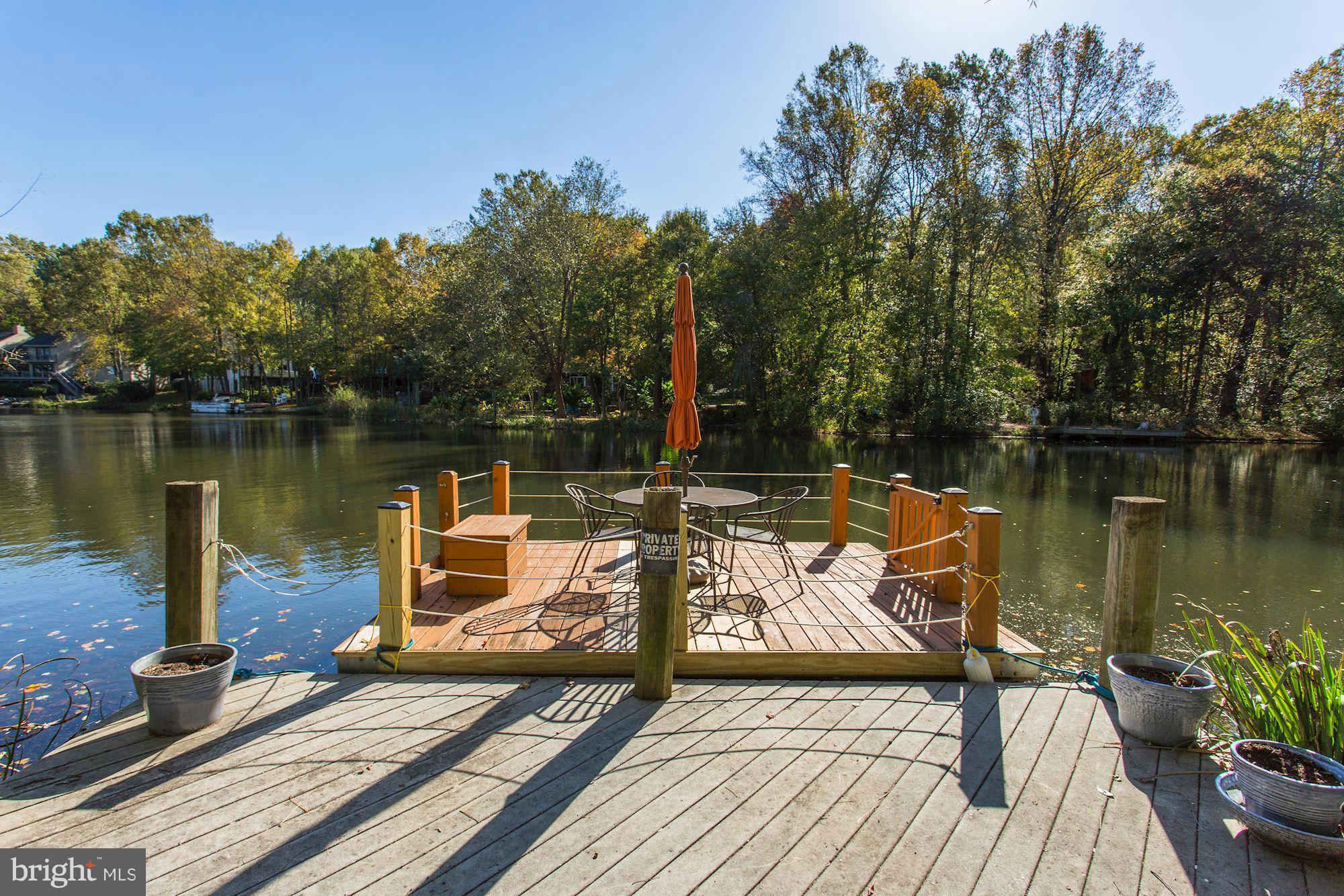2232 Wakerobin Lane Reston, VA 20191 - Photo 3 of 30 a view of a wooden deck with a lake view