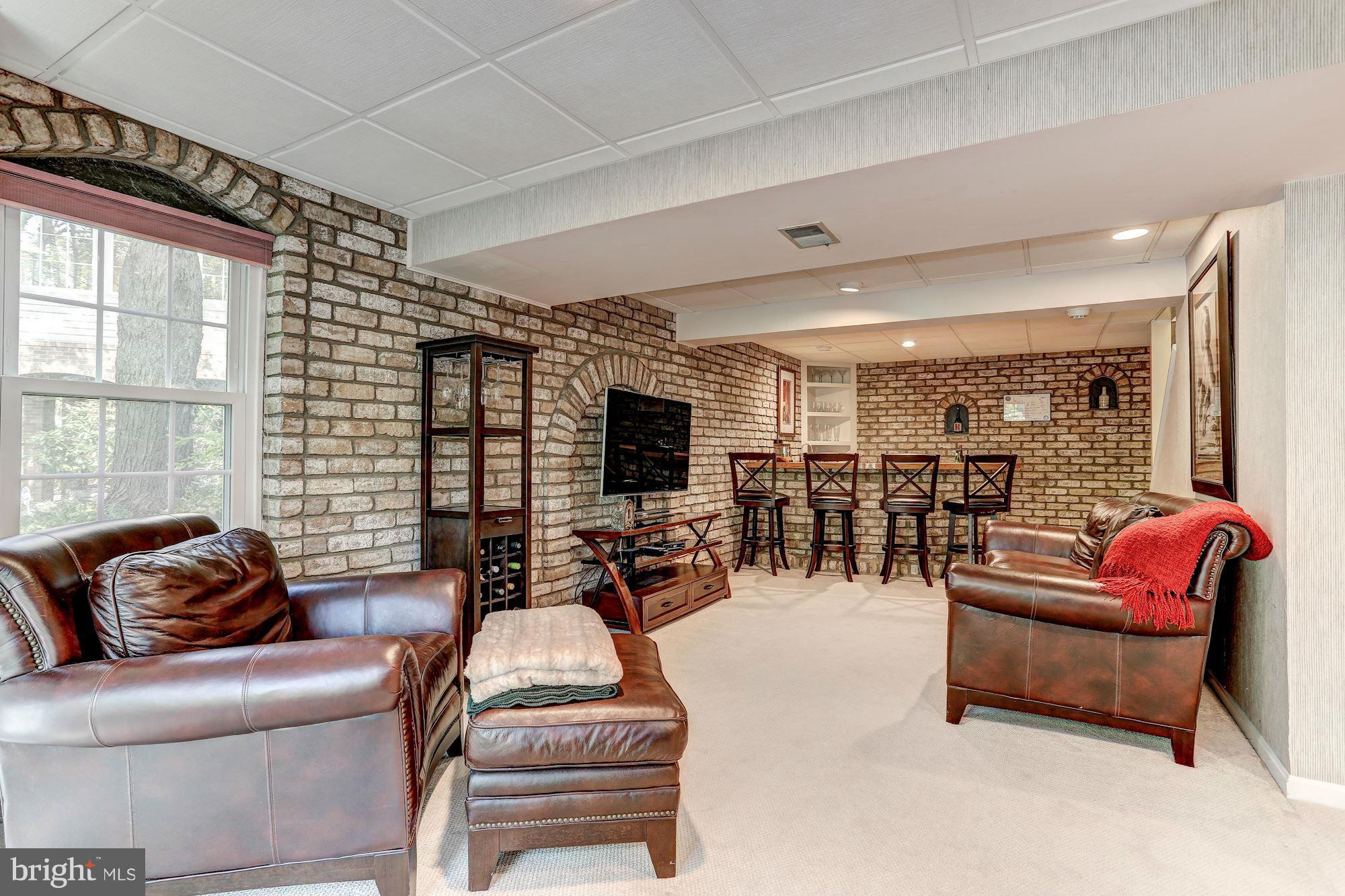 2232 Wakerobin Lane Reston, VA 20191 - Photo 22 of 30 a living room with furniture large window and flat screen tv