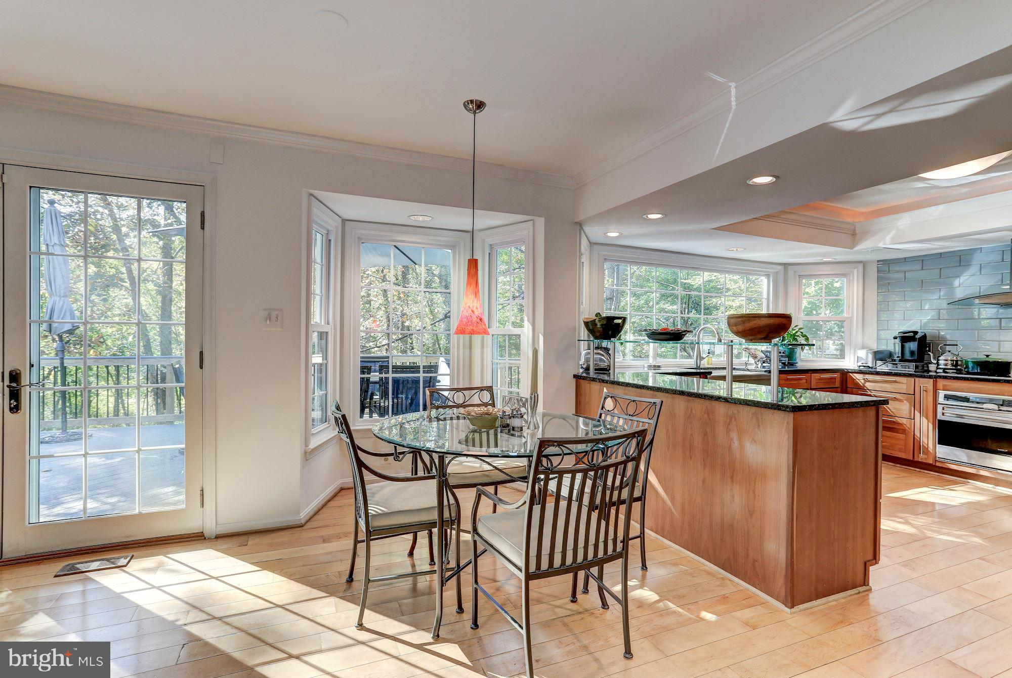2232 Wakerobin Lane Reston, VA 20191 - Photo 7 of 30 a view of a dining room with furniture window and outside view