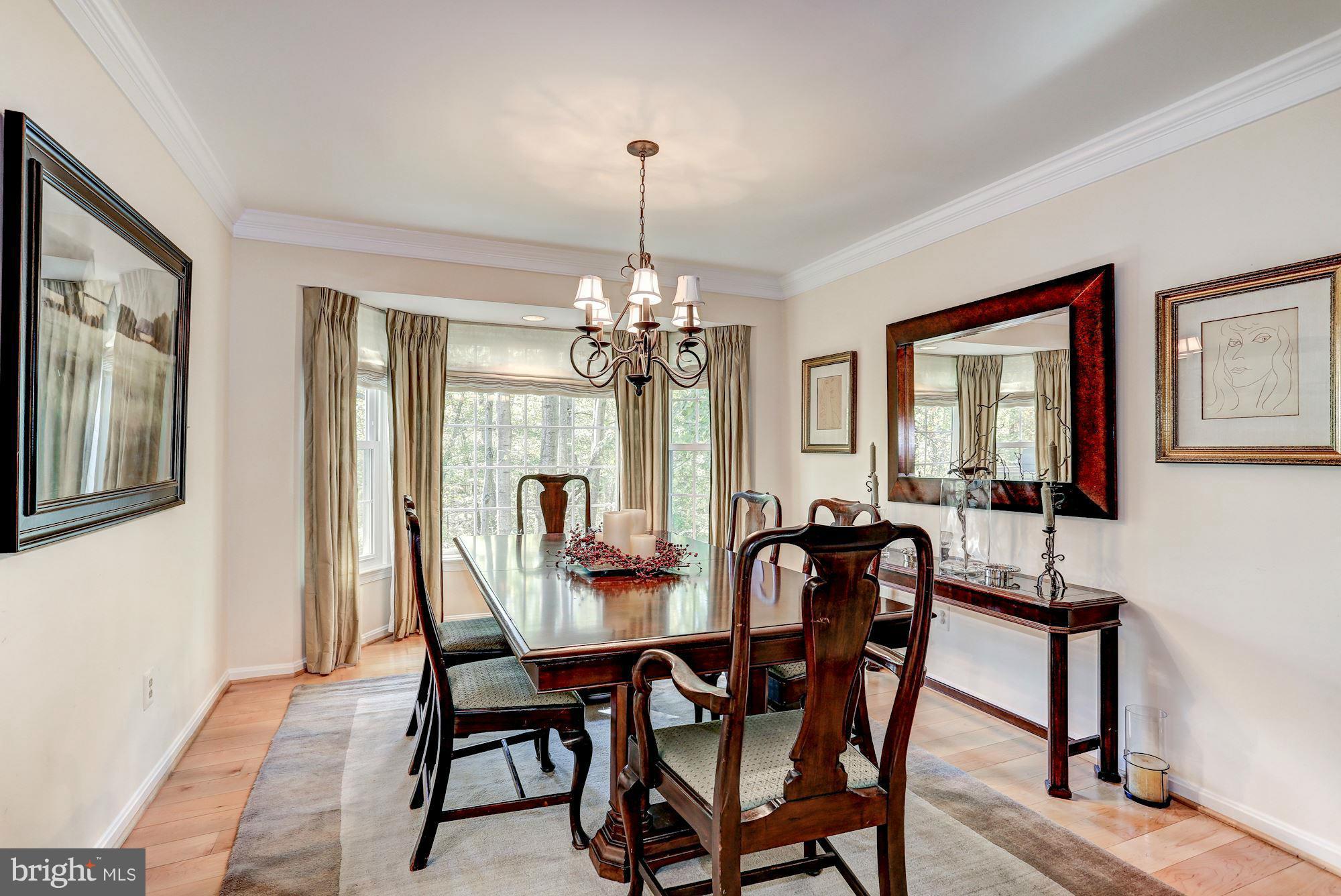 2232 Wakerobin Lane Reston, VA 20191 - Photo 9 of 30 a dining room with furniture window and wooden floor