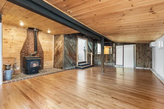 a view of an entryway with wooden floor