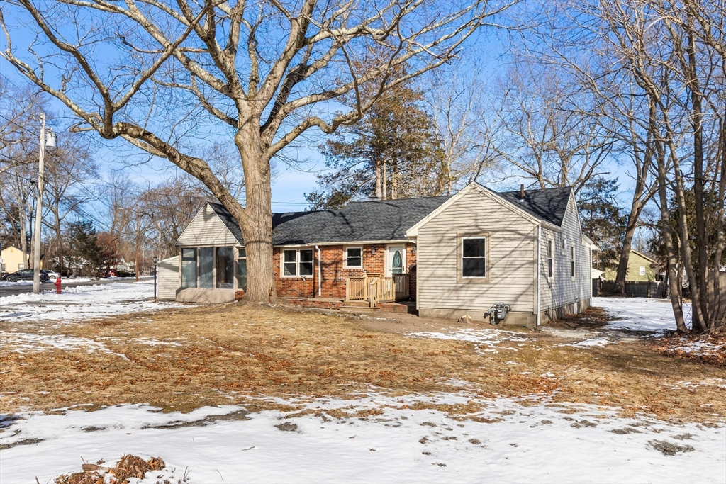 51 Himoor Circle Randolph, MA 02368 - Photo 2 of 29 a white house that has a tree in front of it