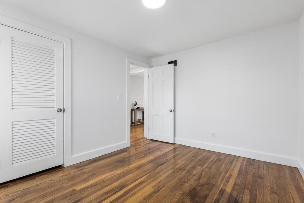 51 Himoor Circle Randolph, MA 02368 - Photo 21 of 29 a view of an empty room with wooden floor