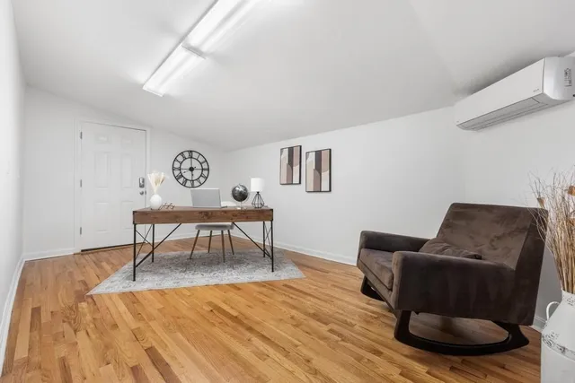 a workspace with furniture and wooden floor