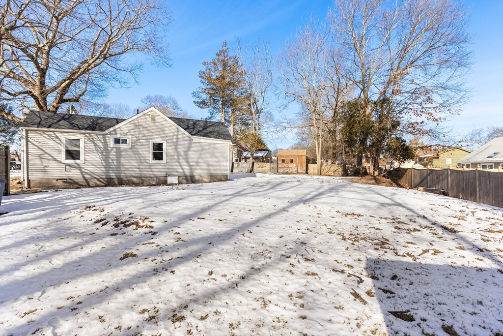 51 Himoor Circle Randolph, MA 02368 - Photo 25 of 29 a view of white house with a yard covered in snow