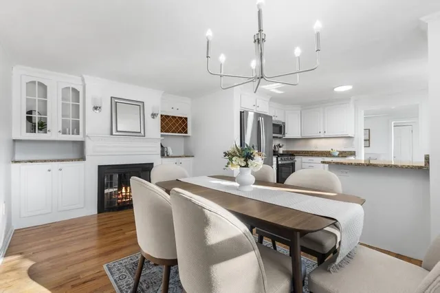 a dining room with furniture and a chandelier