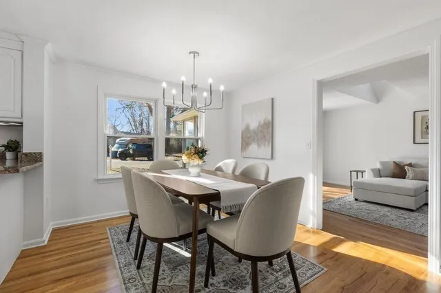 a view of a dining room with furniture window and wooden floor