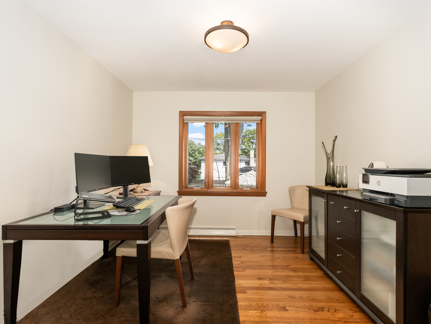 9237 Forestview Road Evanston, IL 60203 - Photo 13 of 33 a view of a workspace with furniture and a window