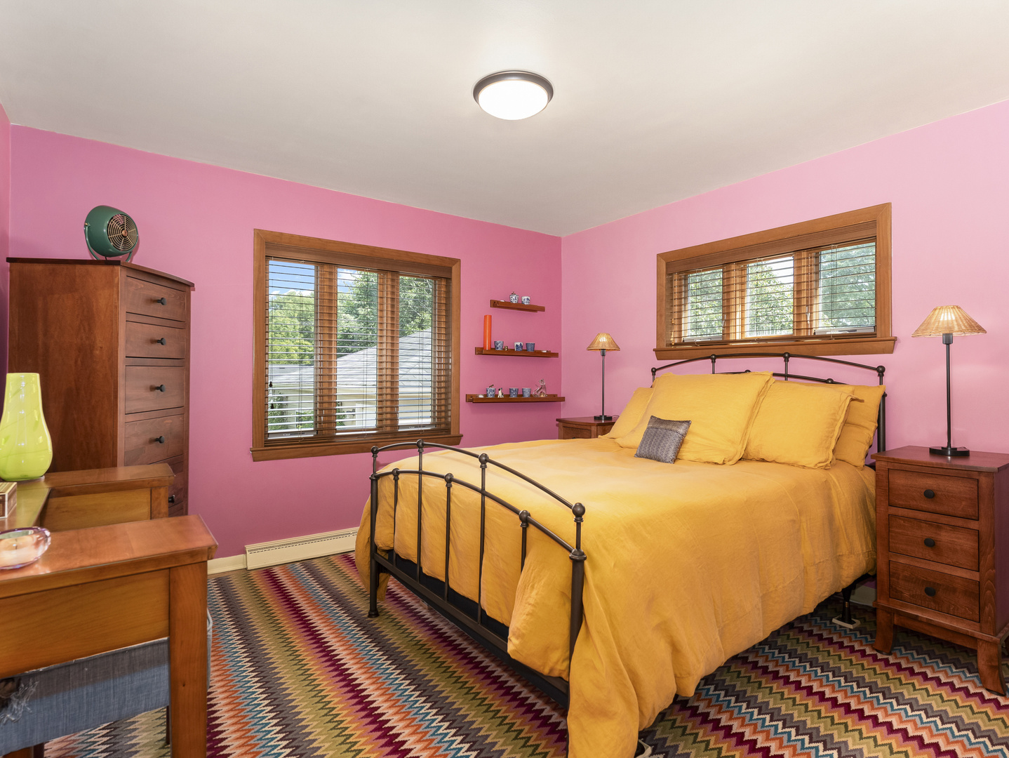 9237 Forestview Road Evanston, IL 60203 - Photo 14 of 33 a bedroom with a bed and wooden floor