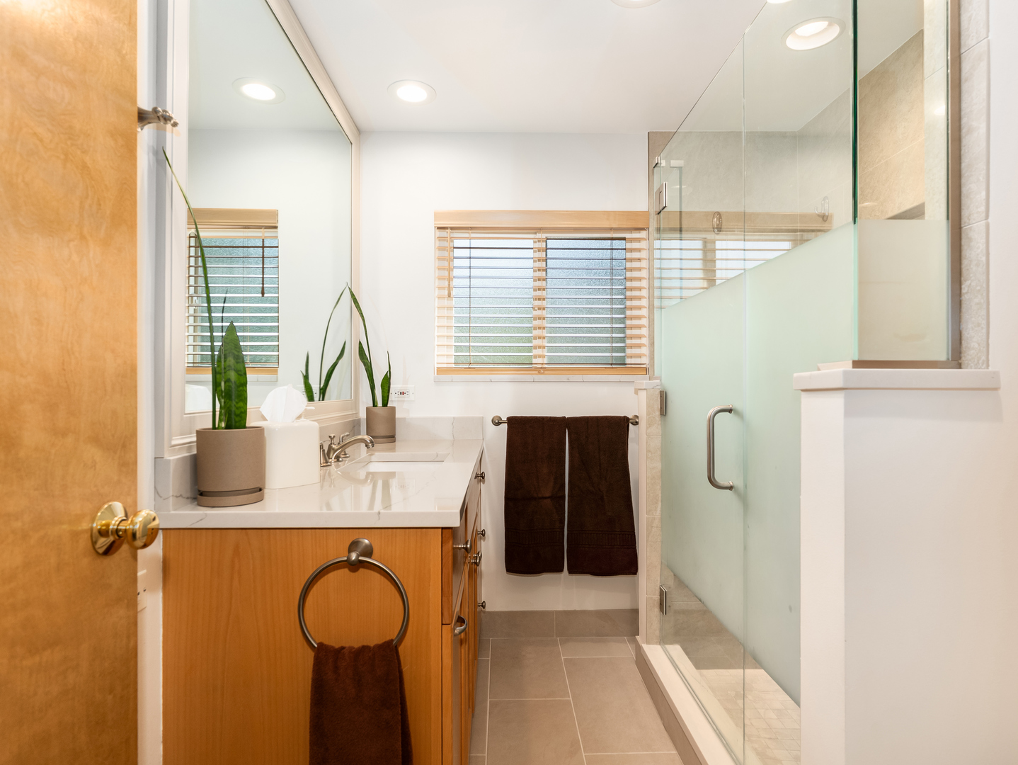 9237 Forestview Road Evanston, IL 60203 - Photo 15 of 33 a bathroom with a sink and a mirror