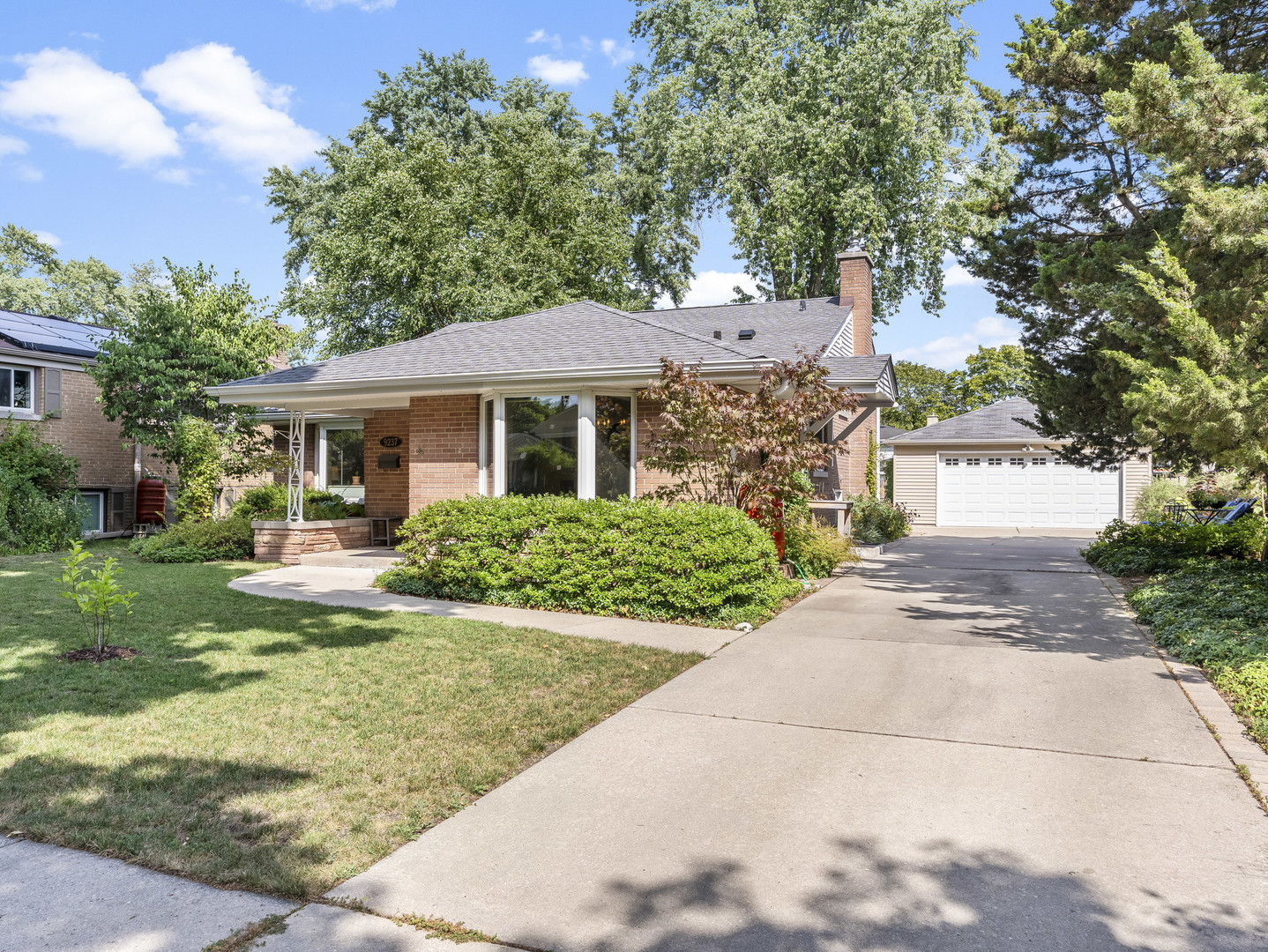 9237 Forestview Road Evanston, IL 60203 - Photo 2 of 33 a front view of a house with a yard and garage