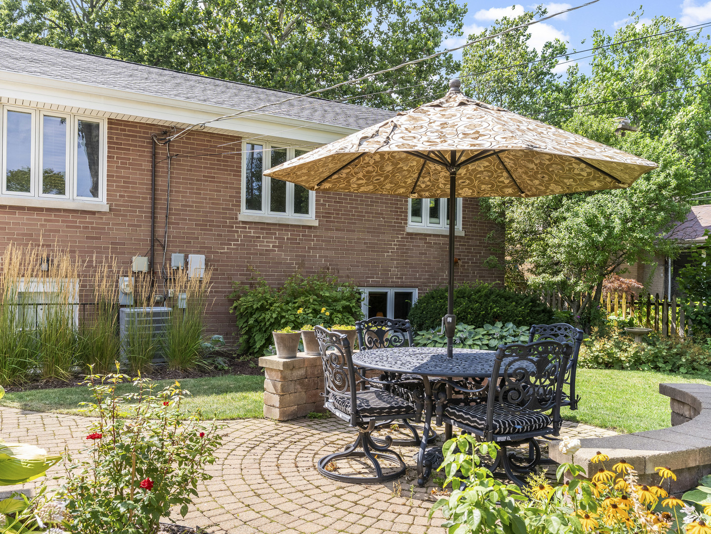 9237 Forestview Road Evanston, IL 60203 - Photo 23 of 33 a view of a patio with table and chairs under an umbrella