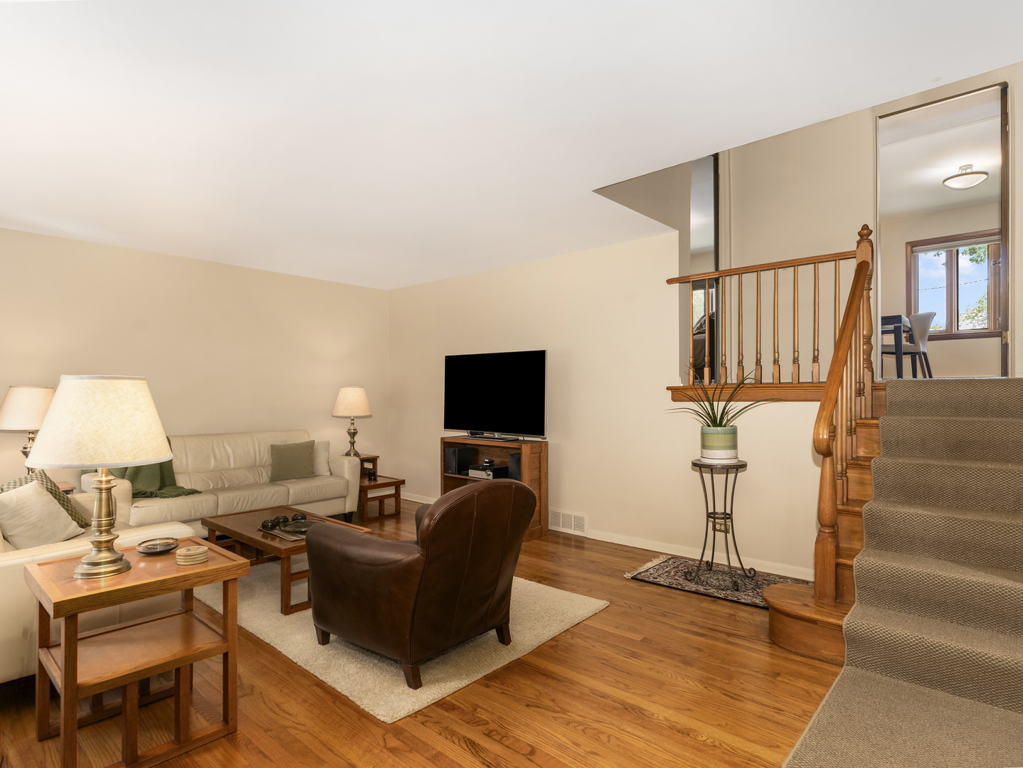 9237 Forestview Road Evanston, IL 60203 - Photo 5 of 33 a living room with furniture and a flat screen tv