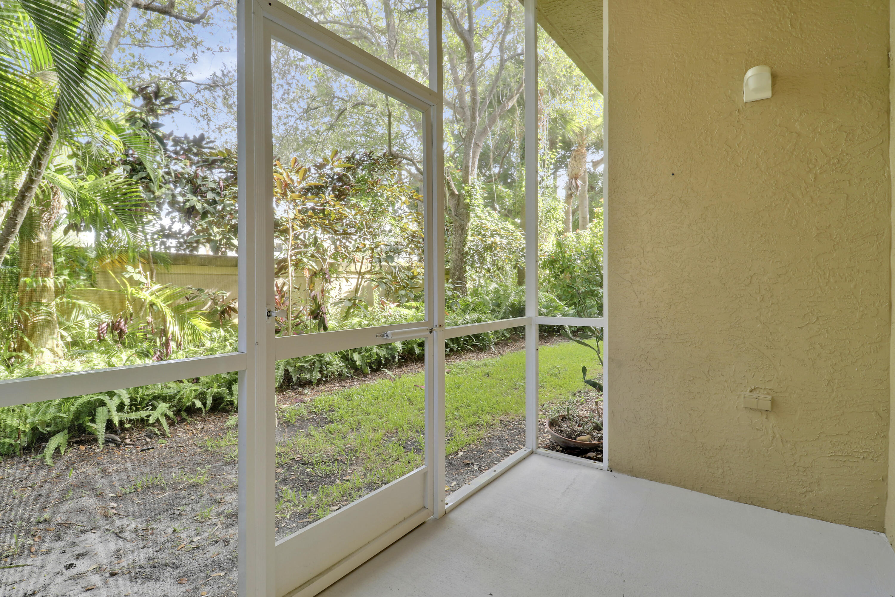 110 Lighthouse Circle, Unit A Tequesta, FL 33469 - Photo 28 of 41 Screened-In Patio