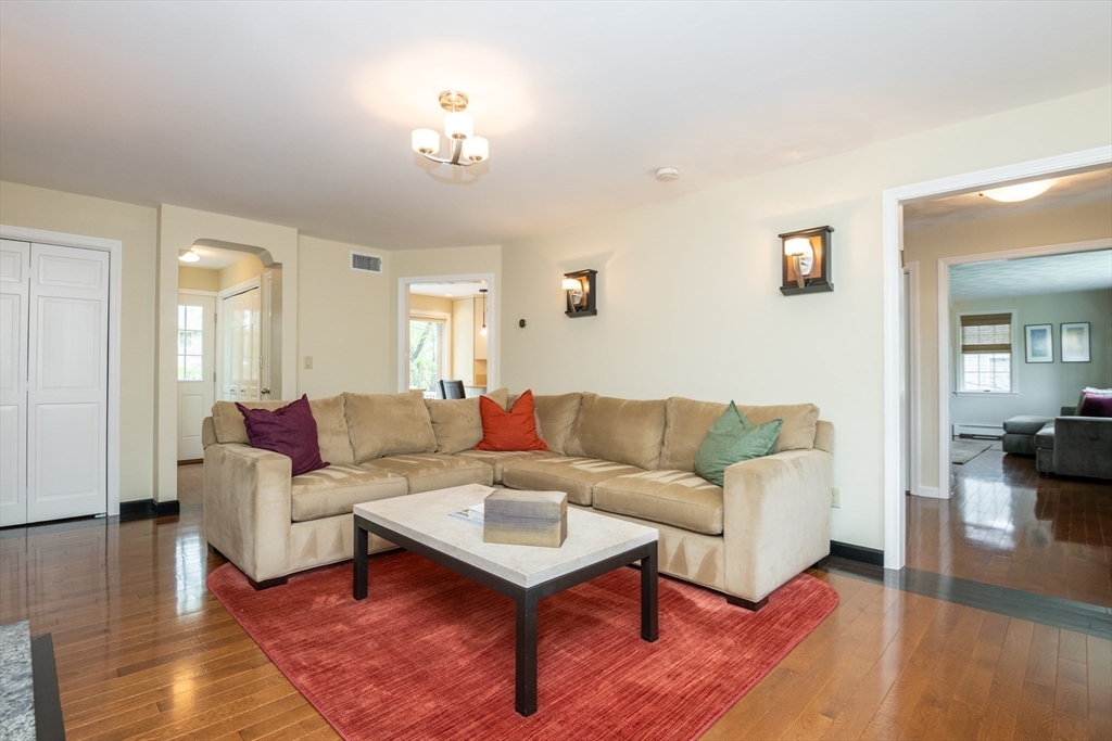 25 Ellen Road Stoneham, MA 02180 - Photo 10 of 41 a living room with furniture and a wooden floor