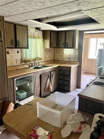 a kitchen with a sink and a stove