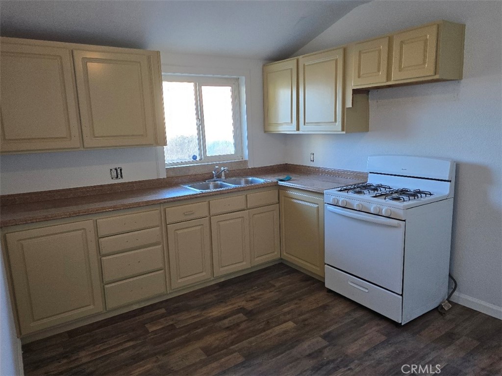 3470 Point Sal Road Casmalia, CA 93429 - Photo 11 of 17 a kitchen with sink cabinets and wooden floor