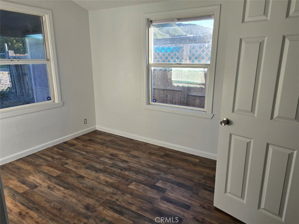3470 Point Sal Road Casmalia, CA 93429 - Photo 5 of 17 a view of an empty room with wooden floor and a window
