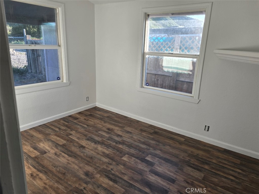 3470 Point Sal Road Casmalia, CA 93429 - Photo 6 of 17 a view of an empty room with wooden floor and a window