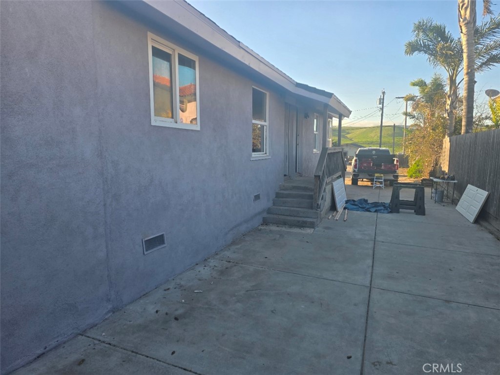 3470 Point Sal Road Casmalia, CA 93429 - Photo 8 of 17 a view of a patio with a table and chairs and potted plants