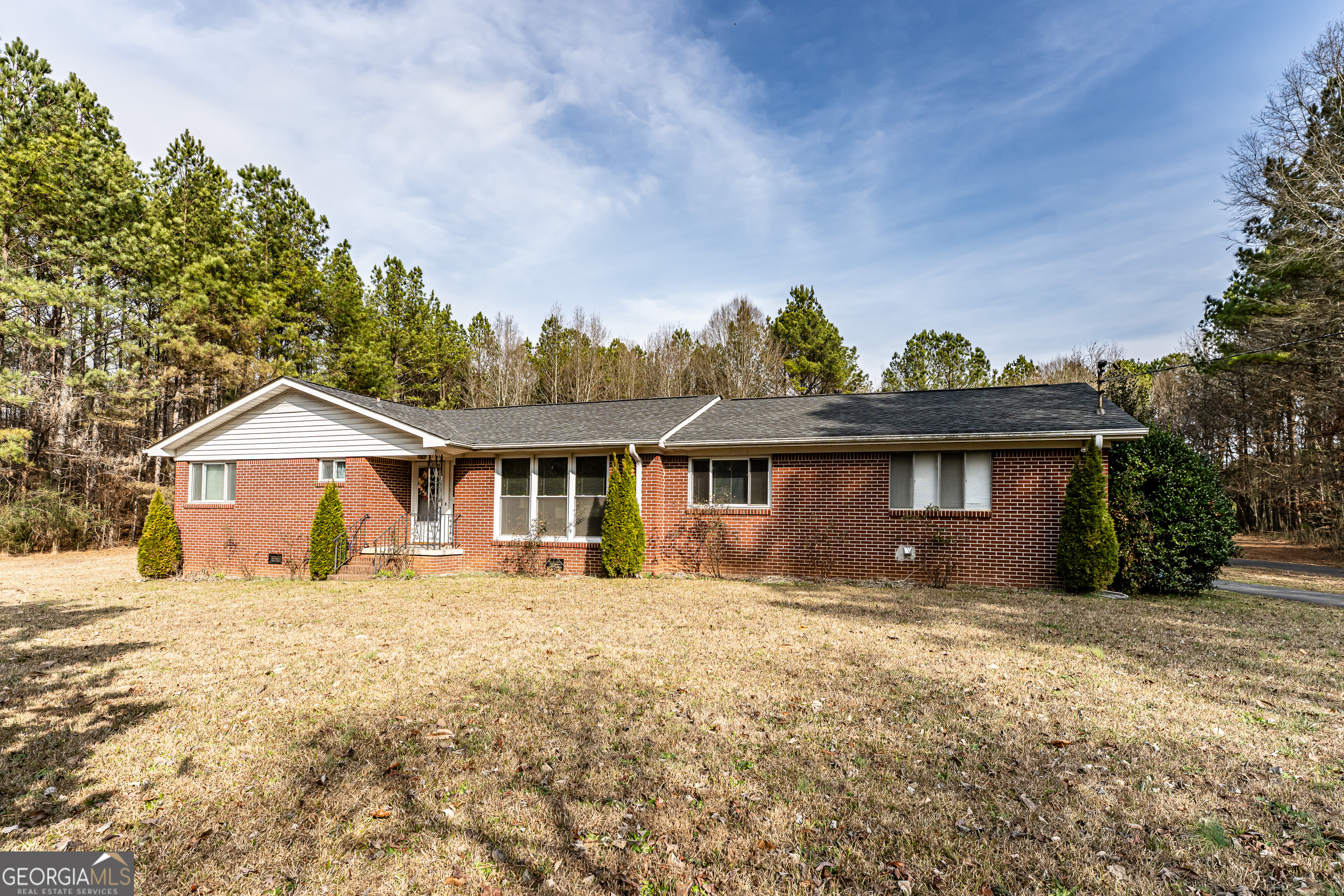 a front view of a house with a yard