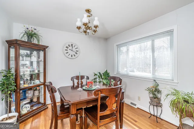 a view of a dining room with furniture window and outside view
