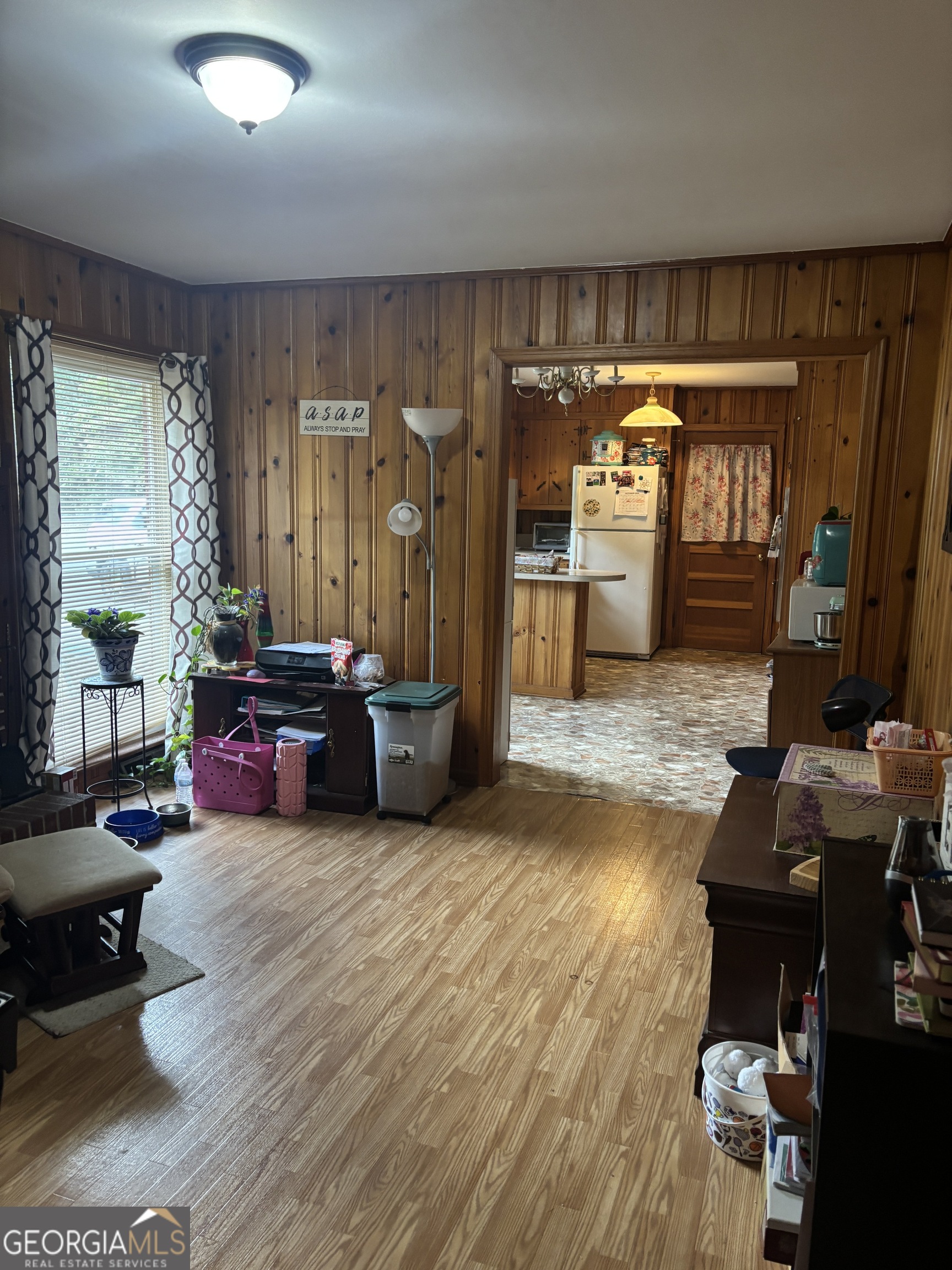 137 New Hermitage Road Northeast Rome, GA 30161 - Photo 13 of 17 a living room with furniture and a floor to ceiling window