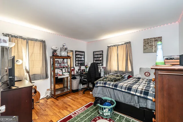 a living room with furniture a rug and a window