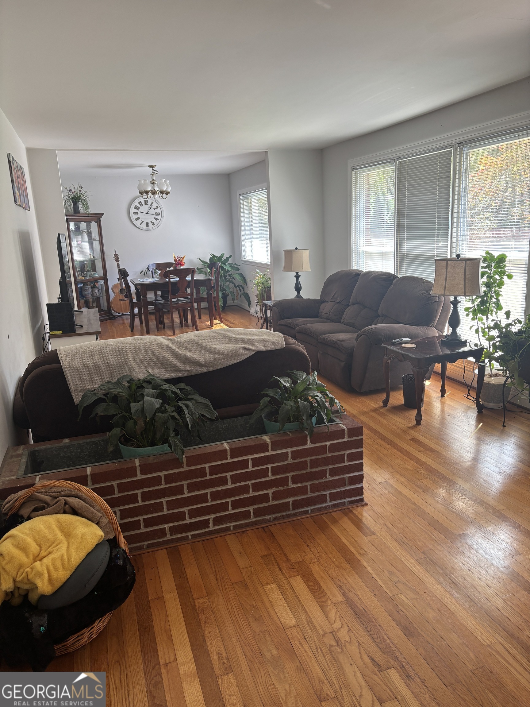 137 New Hermitage Road Northeast Rome, GA 30161 - Photo 8 of 17 a living room with furniture and a floor to ceiling window