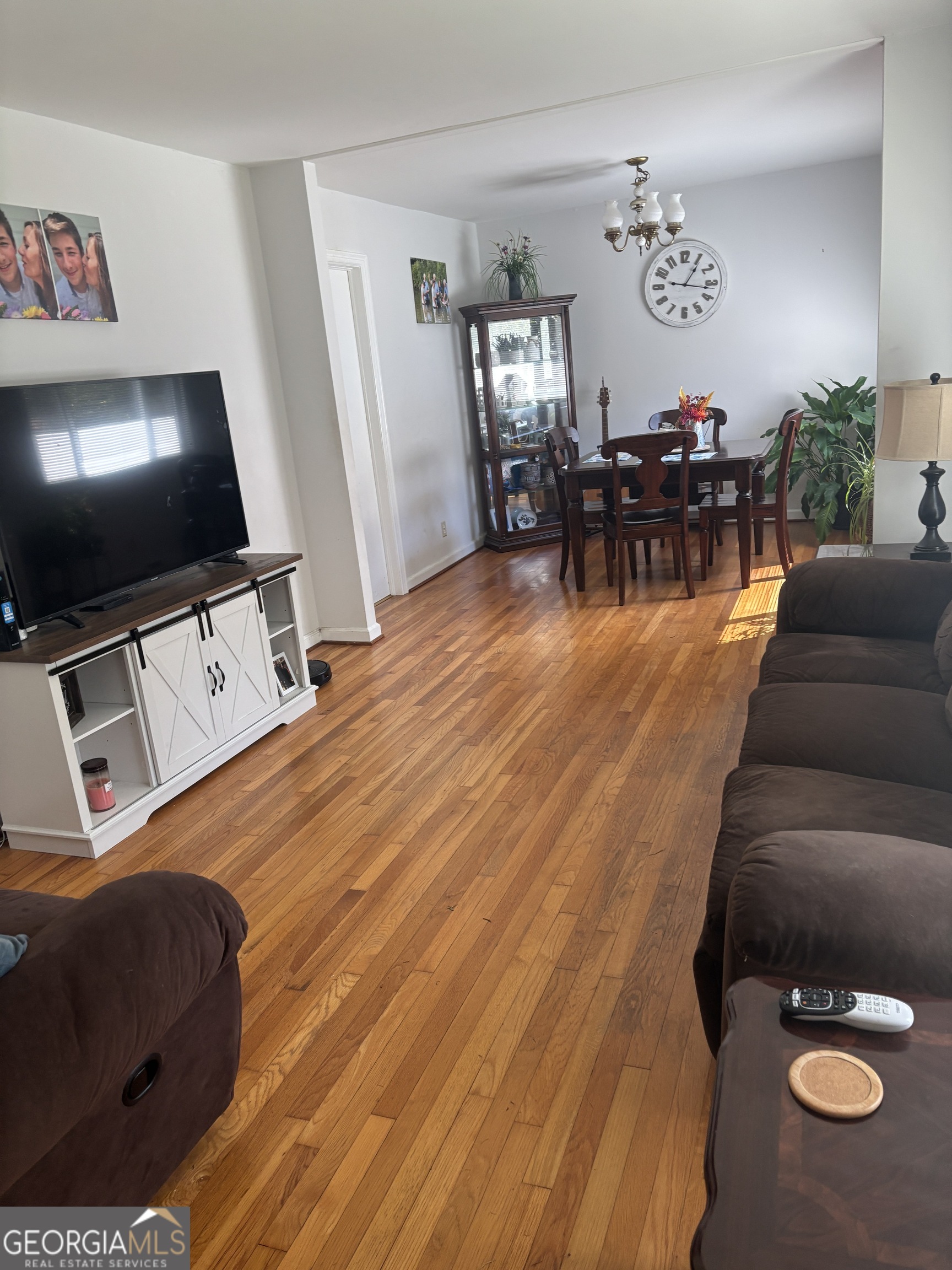 137 New Hermitage Road Northeast Rome, GA 30161 - Photo 9 of 17 a living room with furniture and a flat screen tv
