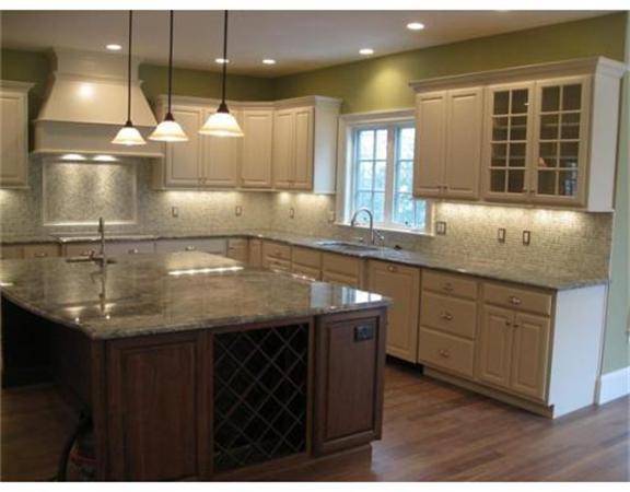 102 Edwardel Road Needham, MA 02492 - Photo 3 of 13 a kitchen with a sink a counter space appliances and cabinets