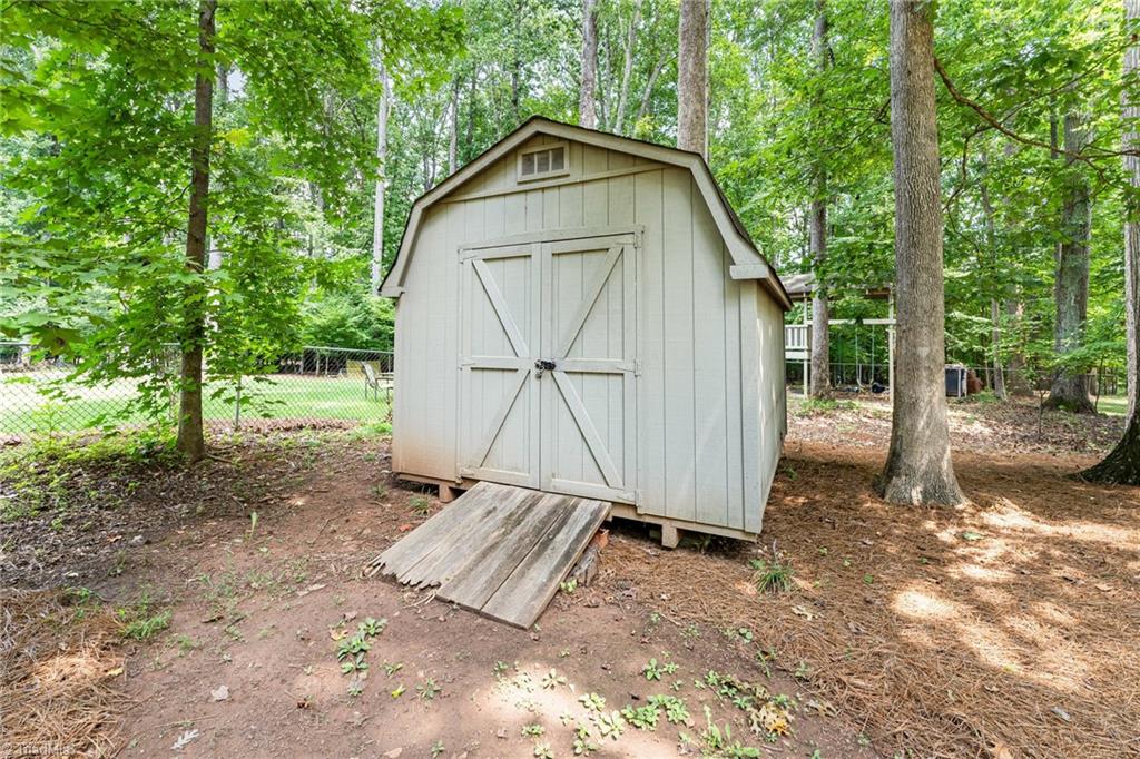 4107 Rockingham Road South Greensboro, NC 27407 - Photo 48 of 50 Large backyard with shed