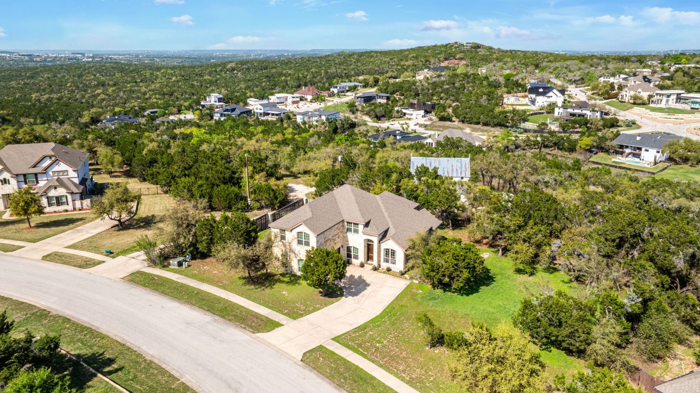 Aerial view showing front of home and the space and privacy offered on this unique lot!