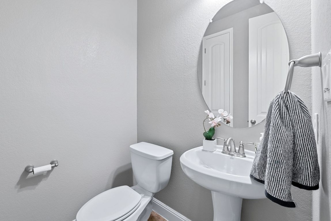 7817 Aria Loop Austin, TX 78736 - Photo 24 of 40 Powder bathroom located on the main level