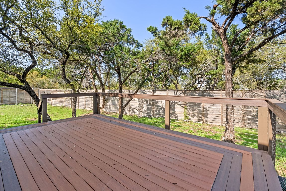 7817 Aria Loop Austin, TX 78736 - Photo 34 of 40 Beautiful TREX deck! Enjoy the privacy that almost one acre provides without all of the yard maintenance! Unique lot layout allows for tranquil manicured areas and lush, natural spots as well!