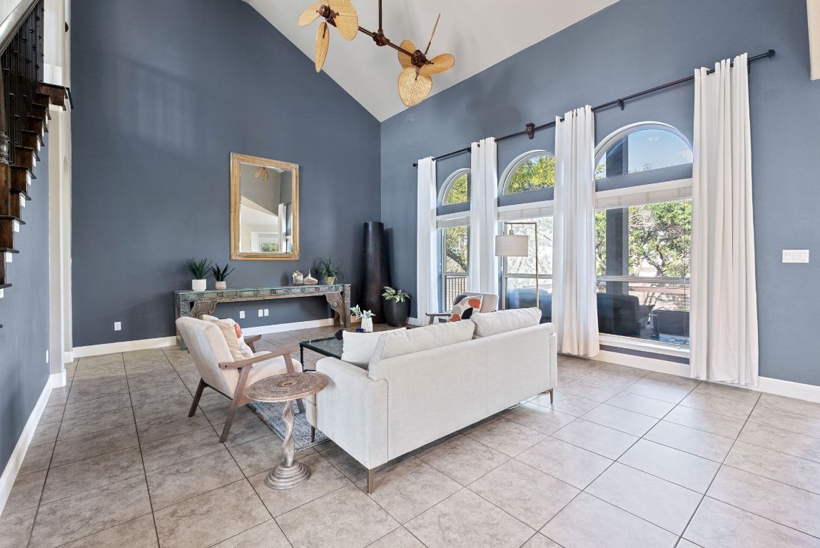 7817 Aria Loop Austin, TX 78736 - Photo 9 of 40 The living room has a soaring 2-story ceiling!