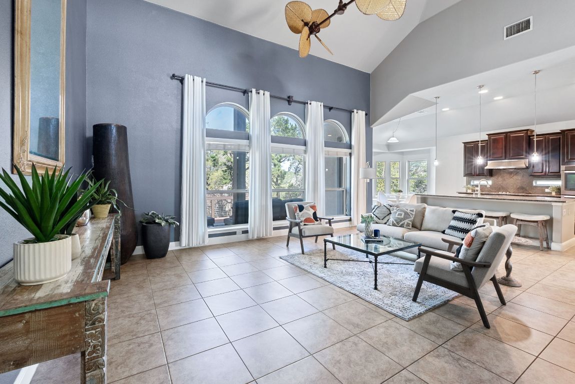7817 Aria Loop Austin, TX 78736 - Photo 10 of 40 Enjoy the large windows that overlook the back deck and yard.