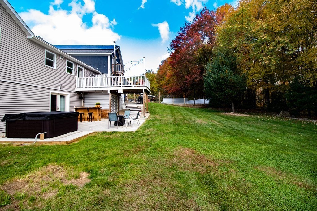 96 Cold Hill Granby, MA 01033 - Photo 11 of 42 a view of an house with backyard porch and furniture